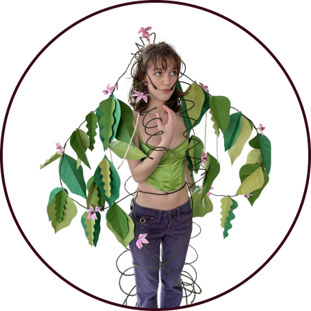 Plant person covered in leaves and flowers